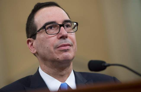 財政部長米努勤在眾院說明預(yù)算的錢從哪里來。(美國《世界日報》/Getty圖片)