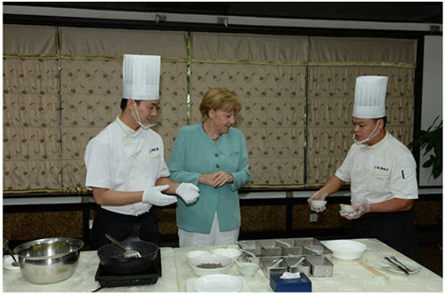 2014年，默克爾在成都川菜館。