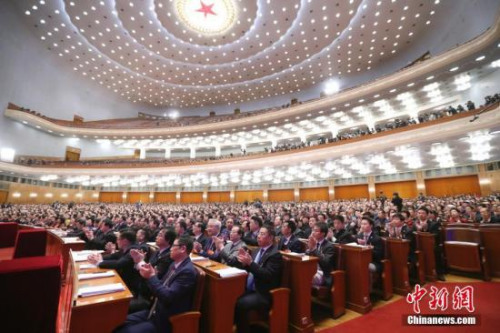 3月15日，全國政協(xié)十三屆一次會議在北京人民大會堂舉行閉幕會。列席會議的海外僑胞代表在會場就座。<a target='_blank' >中新社</a>記者 盛佳鵬 攝