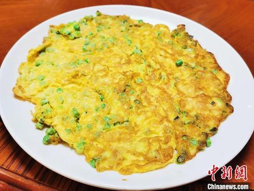 中國僑網(wǎng)豆角粒煎蛋 李曉春 攝